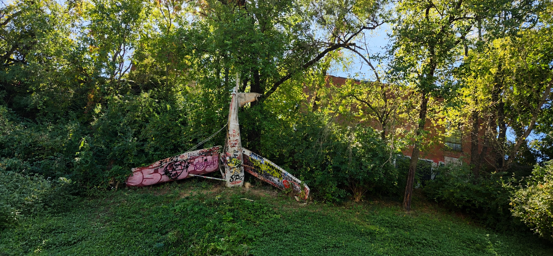 Crashed airplane structure covered in graffiti in Louisville